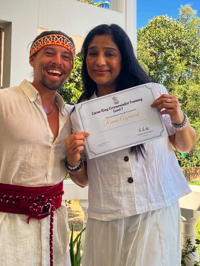 Reena with her facilitator certificate and Andreas